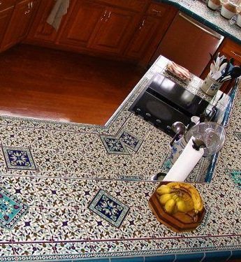 Kitchen counter top using 15x15cm floral series and matching borders Kitchen tile countertop