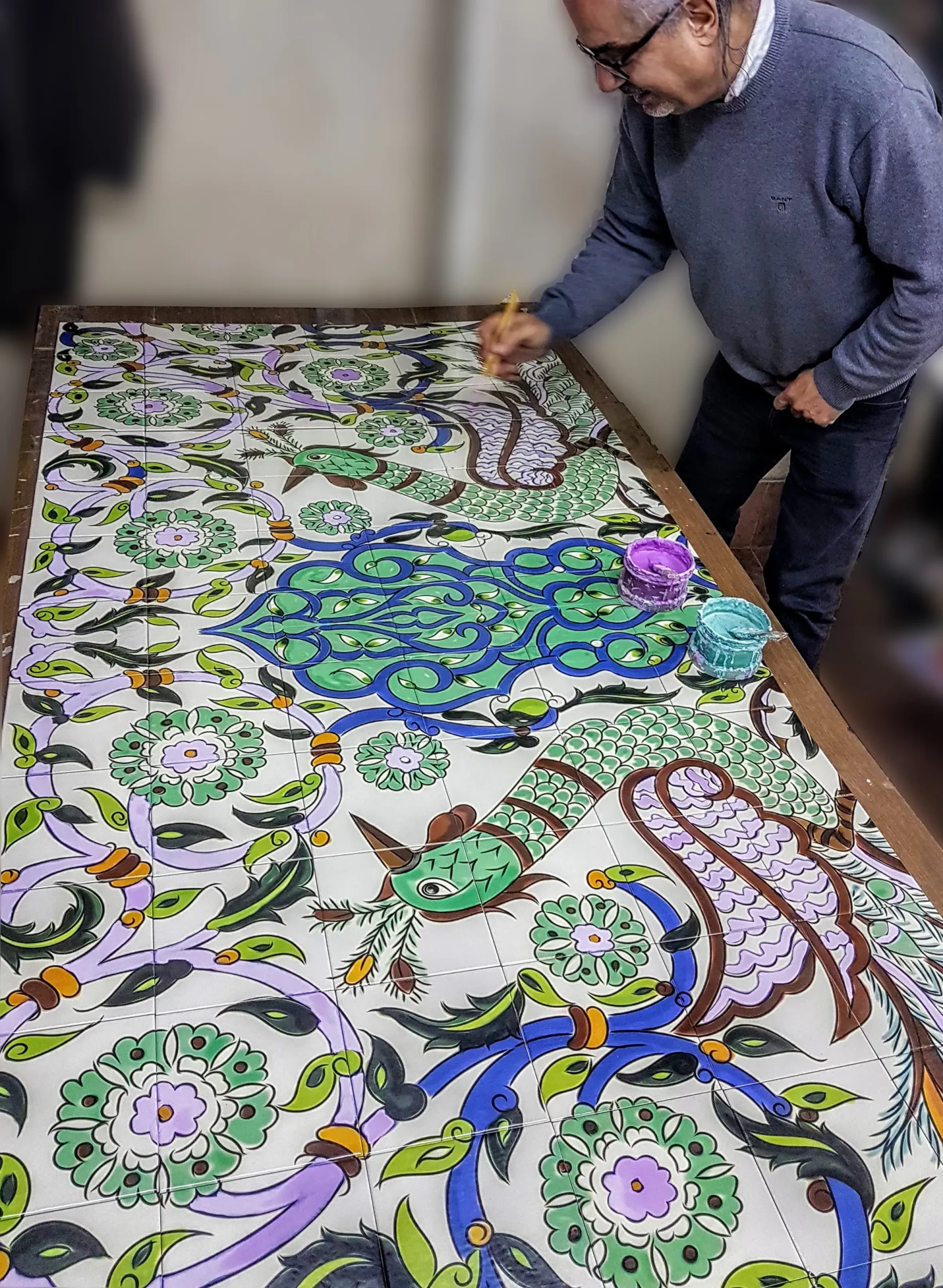 A bespoke hand painted ceramic tile mural