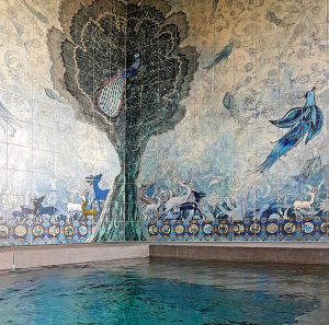 Custom artistic tile mural around a hot tub